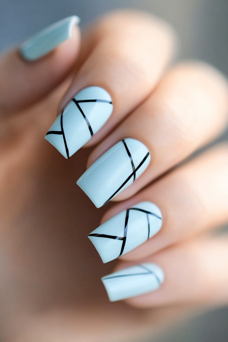 20. Light Blue with Black Detailing (Light Blue Nail Design Ideas) - Light Blue Nail Design Ideas