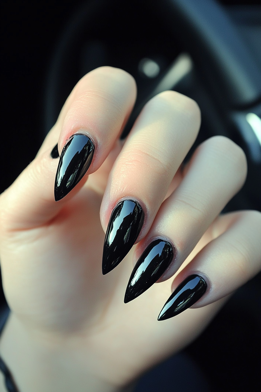 1. Sleek Black Stiletto Nails (Long Nail Design Ideas) - Long Nail Design Ideas