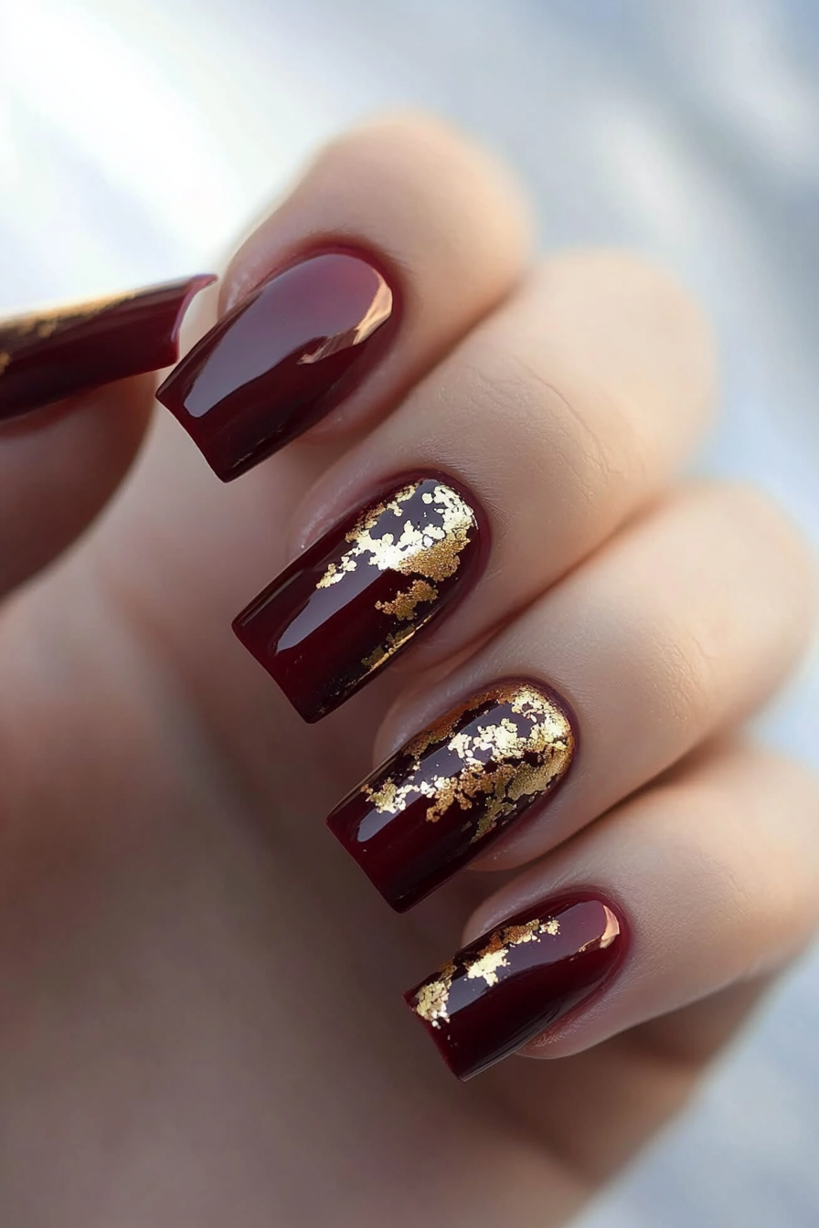 3. Maroon and Gold Foil Accents (Maroon Color Nail Design Ideas) - Maroon Color Nail Design Ideas