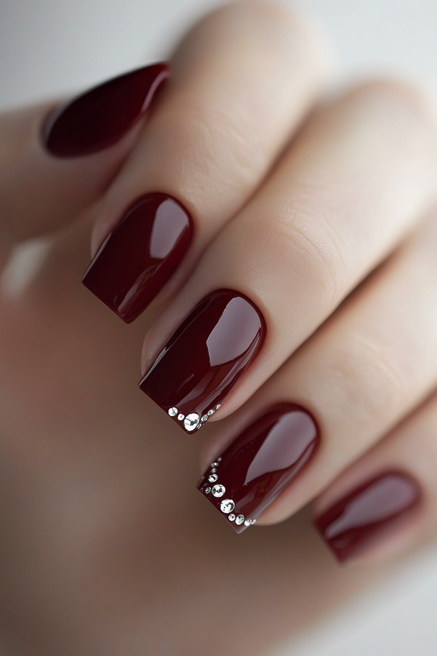 7. Glossy Maroon with Rhinestone Accents (Maroon Color Nail Design Ideas) - Maroon Color Nail Design Ideas