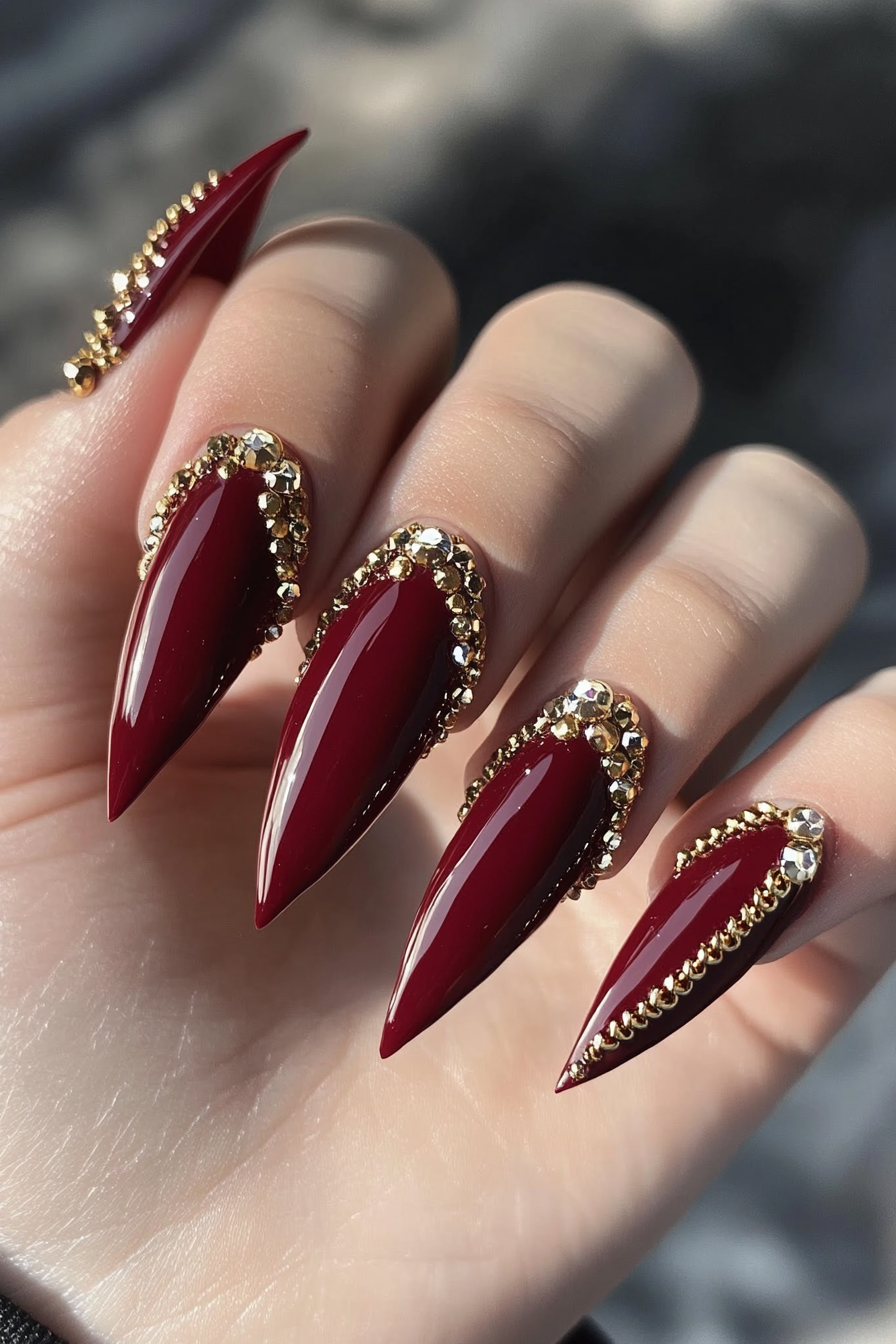22. Maroon Stiletto Nails with Gold Chains (Maroon Color Nail Design Ideas) - Maroon Color Nail Design Ideas