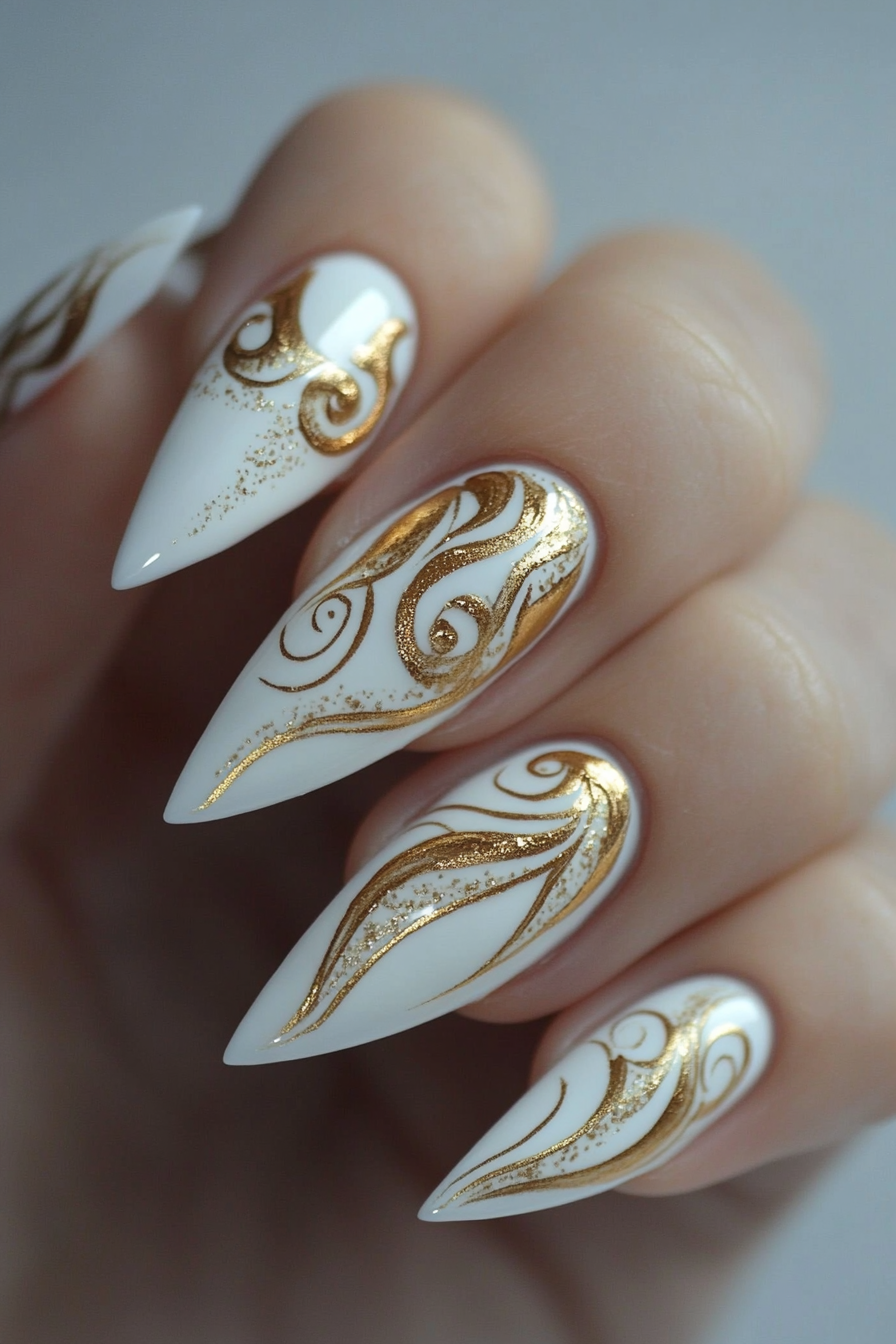 9. Golden Stiletto Nails with White Swirls (White And Gold Nail Design Ideas) - White And Gold Nail Design Ideas